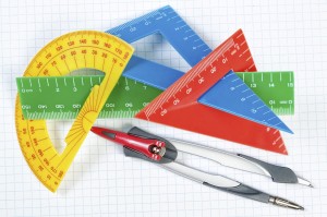 Instruments for drawing in school. Ruler and compass. Close-up.